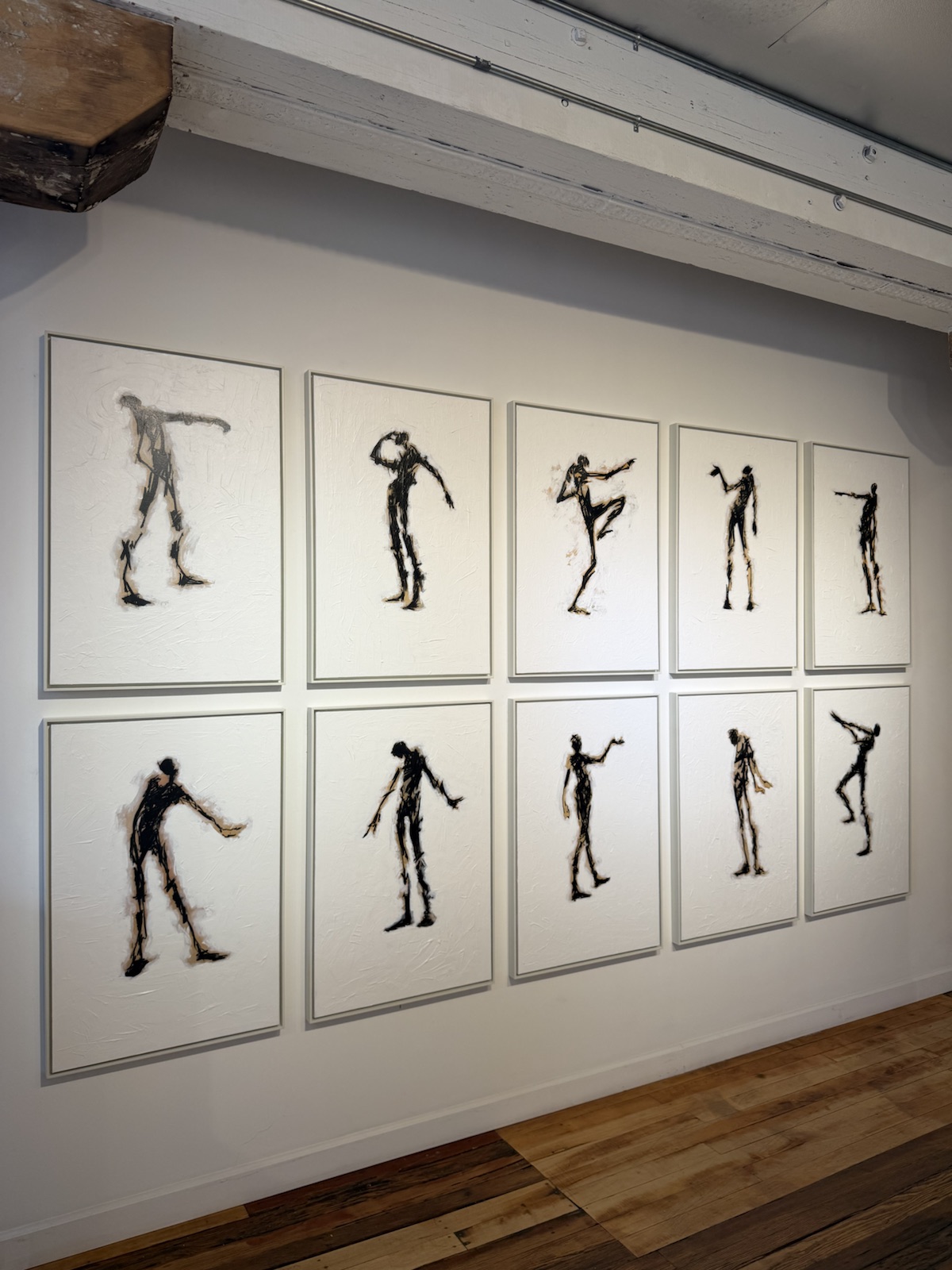 Gallery wall art installation in a residential interior