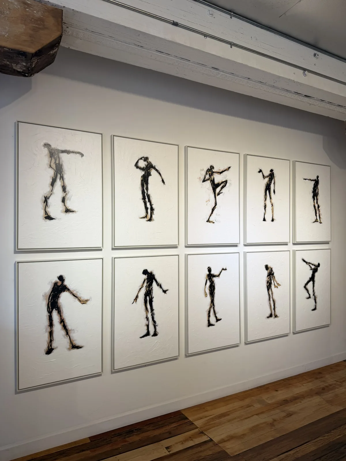 Gallery wall art installation in a residential interior