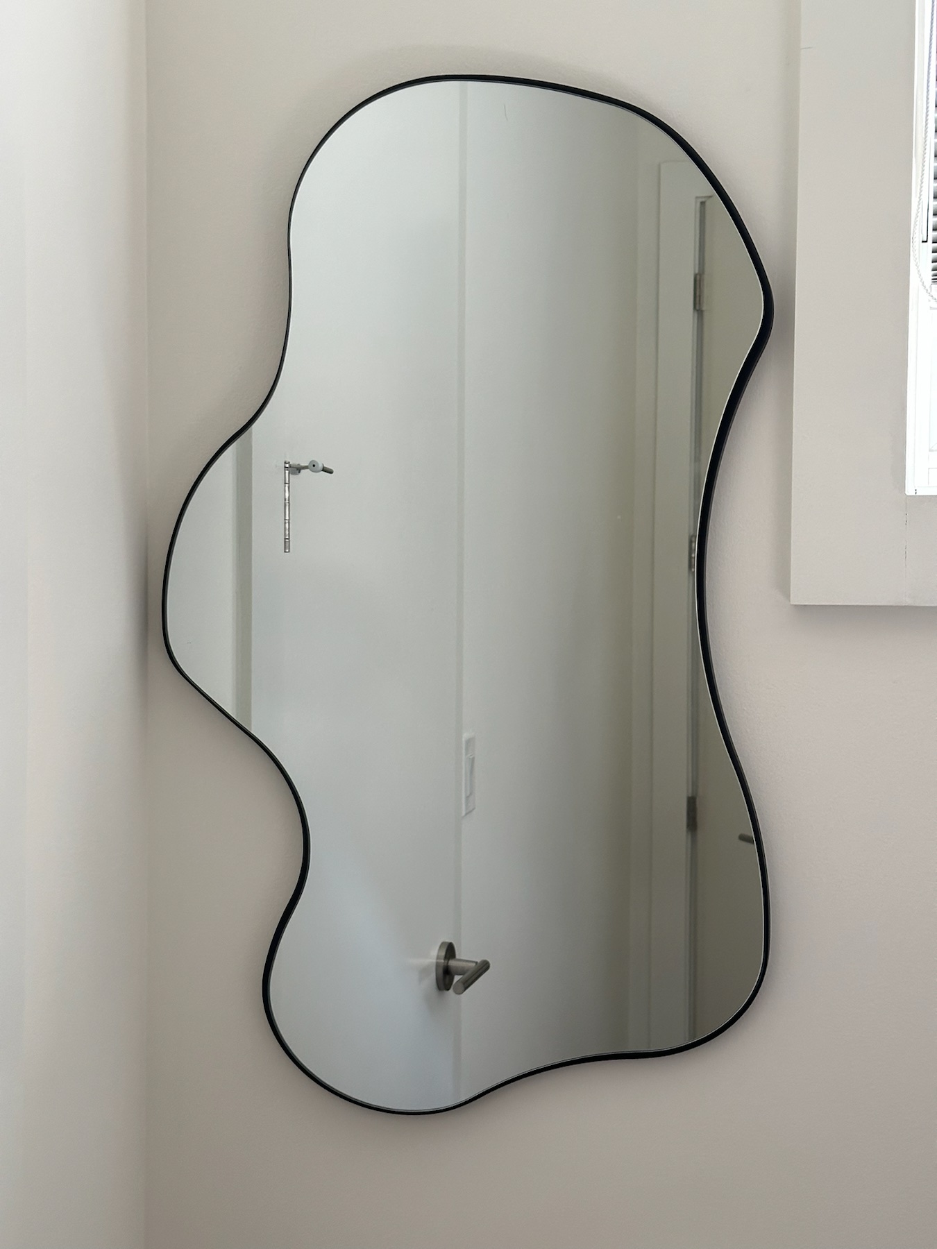 Completed mirror installation by ORLEG Mounting Services