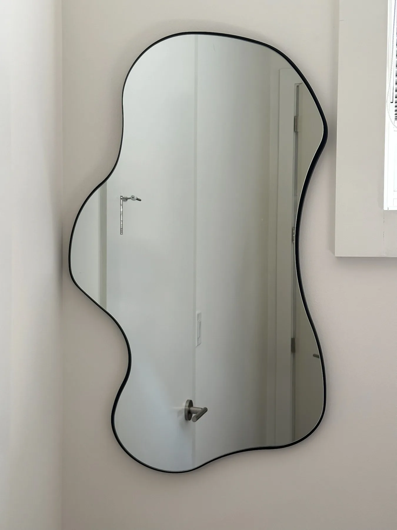 Completed mirror installation by ORLEG Mounting Services