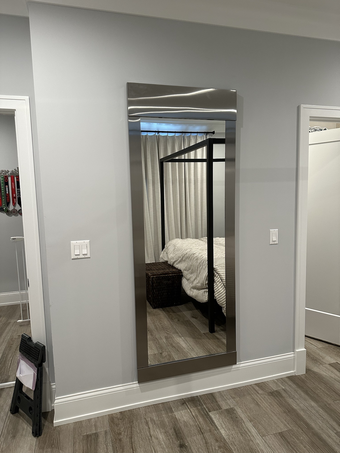 Completed mirror installation by ORLEG Mounting Services