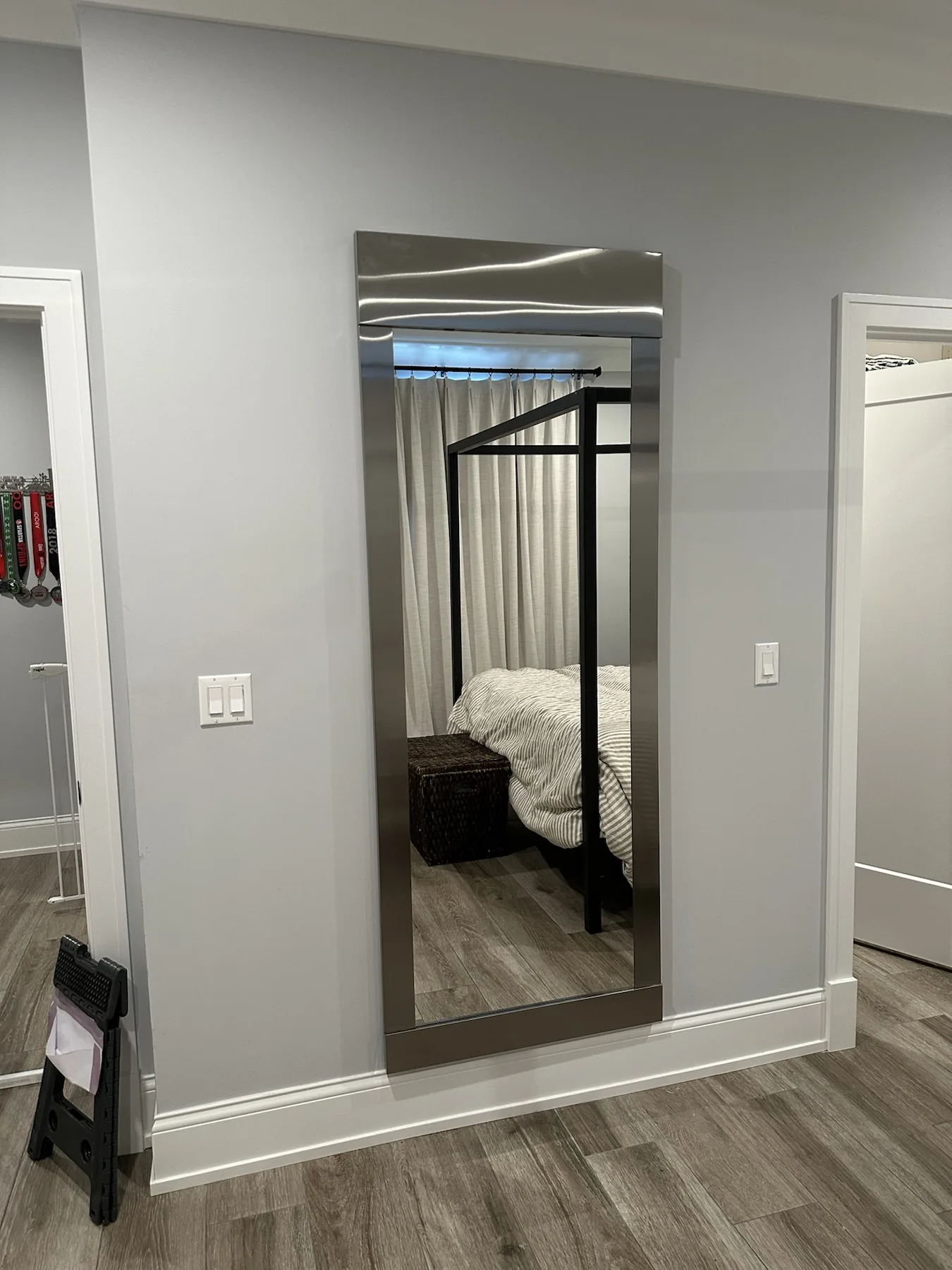 Completed mirror installation by ORLEG Mounting Services