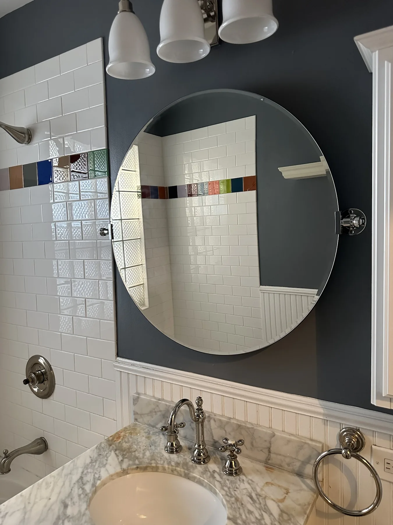 Completed mirror installation by ORLEG Mounting Services