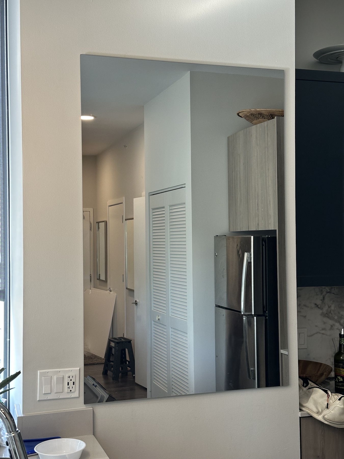 Completed mirror installation by ORLEG Mounting Services