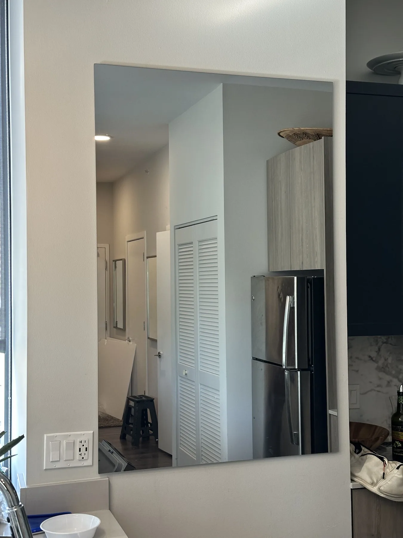 Completed mirror installation by ORLEG Mounting Services