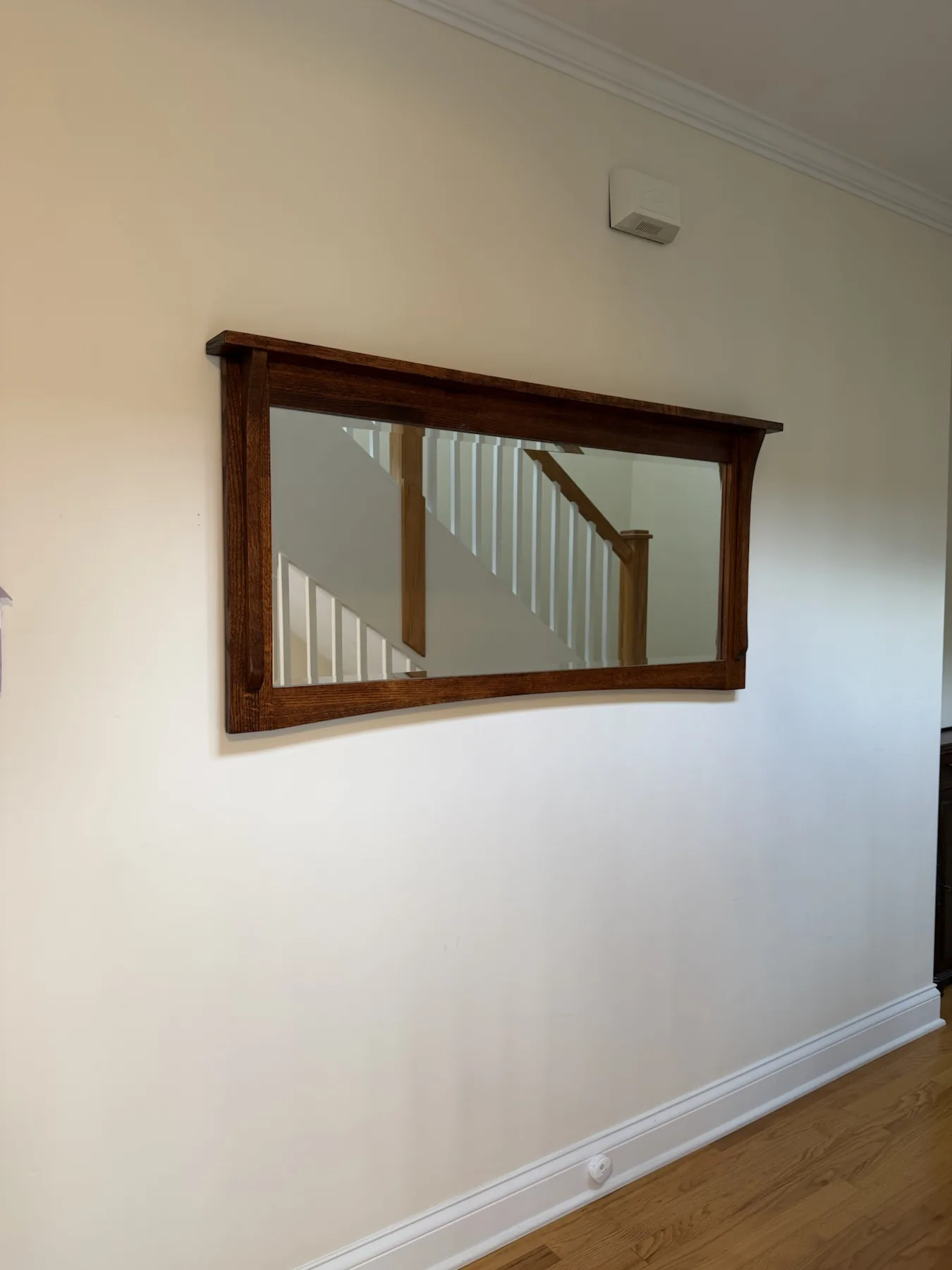 Completed mirror installation by ORLEG Mounting Services