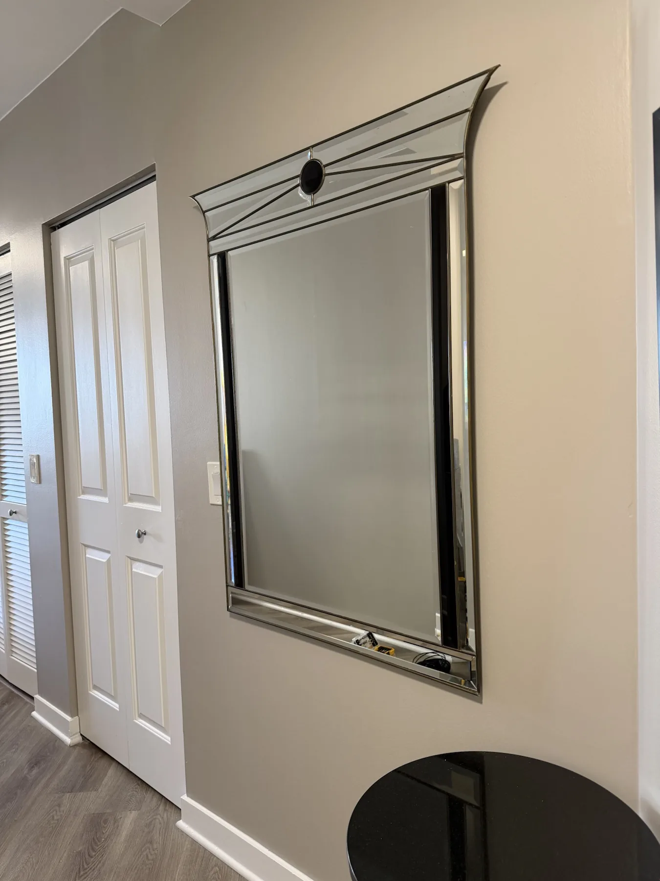 Completed mirror installation by ORLEG Mounting Services