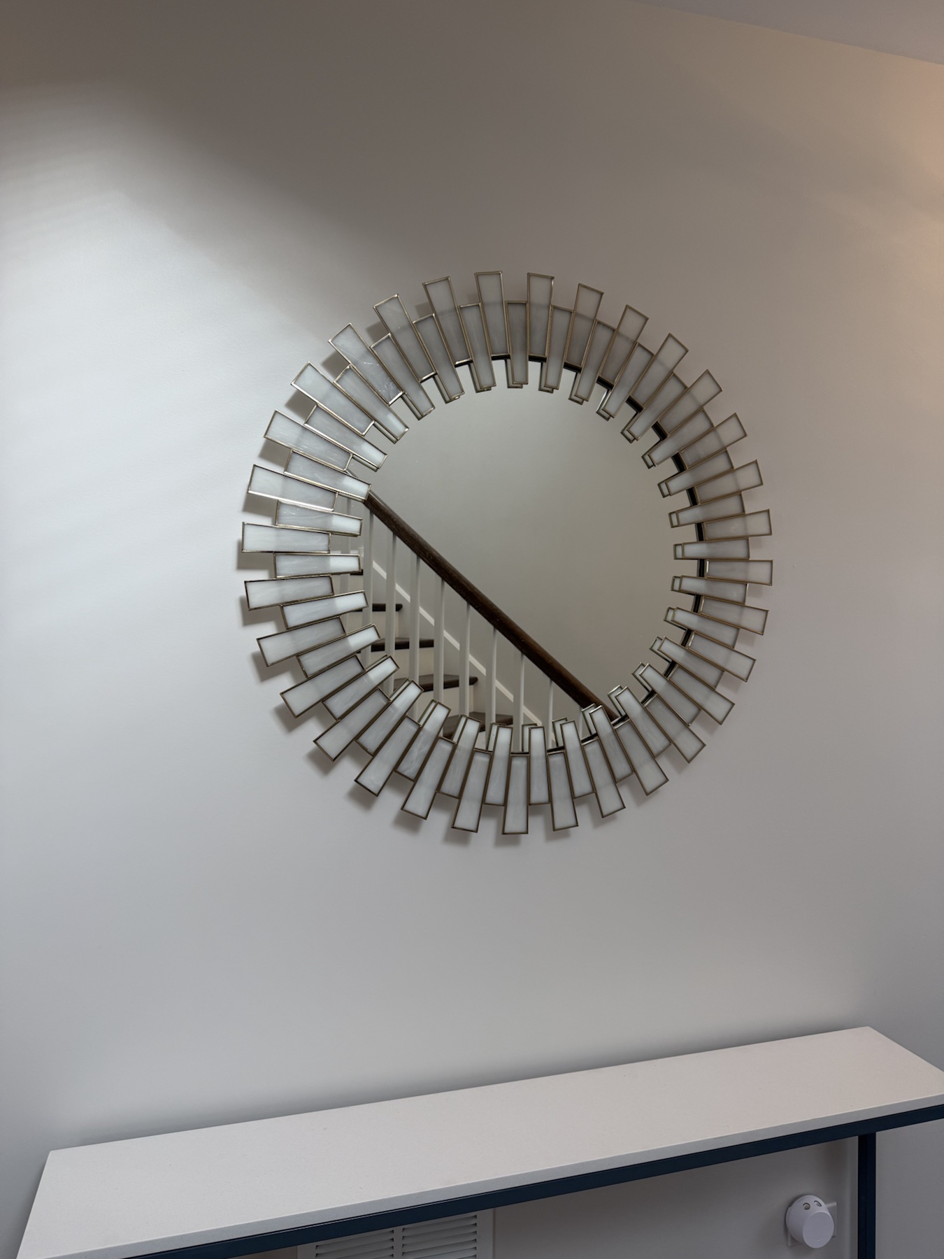 Completed mirror installation by ORLEG Mounting Services