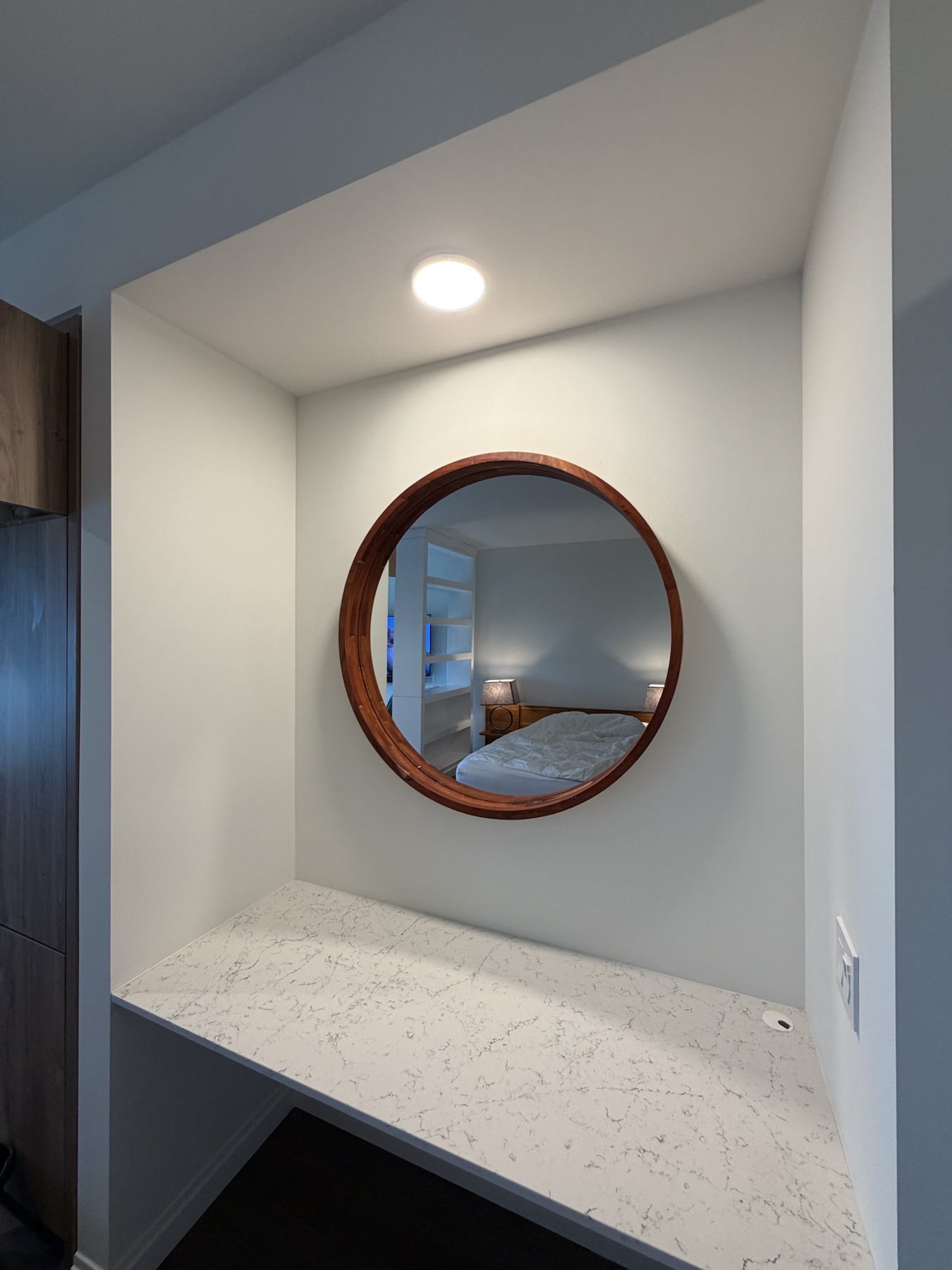 Completed mirror installation by ORLEG Mounting Services