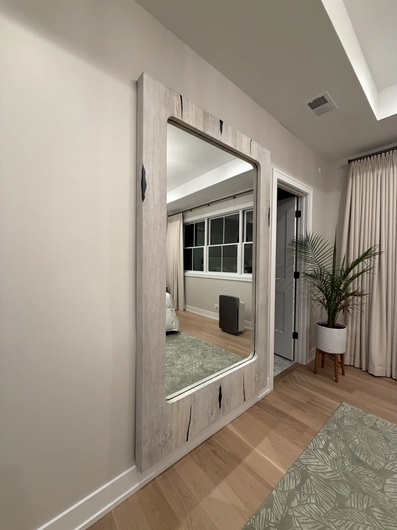 Completed mirror installation by ORLEG Mounting Services