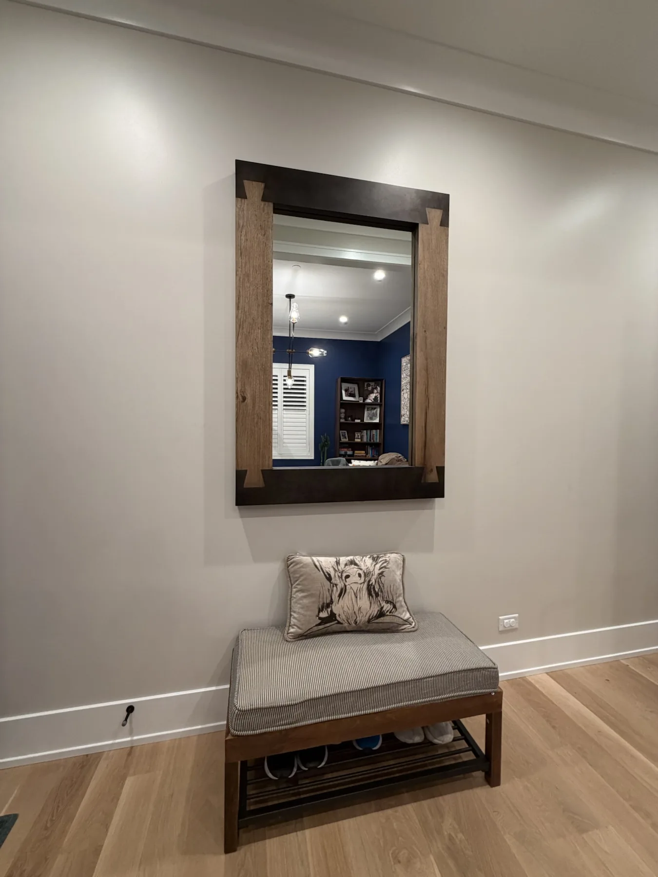 Completed mirror installation by ORLEG Mounting Services