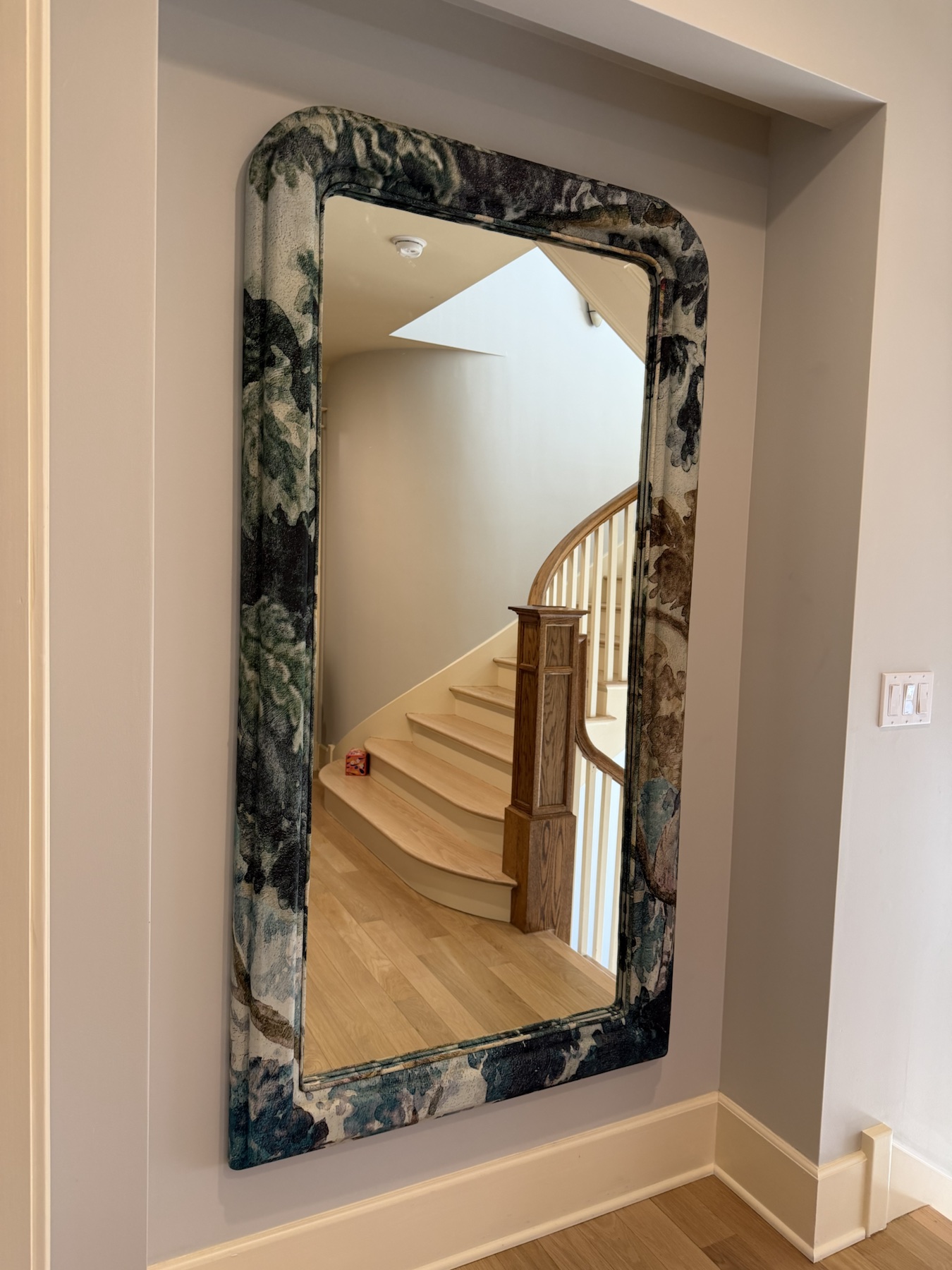 Completed mirror installation by ORLEG Mounting Services