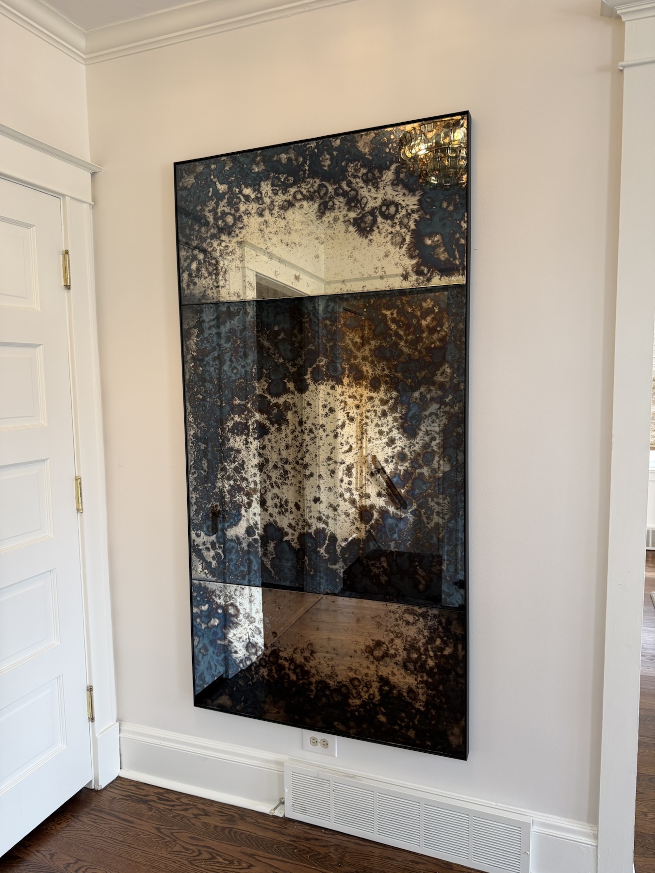 Completed mirror installation by ORLEG Mounting Services