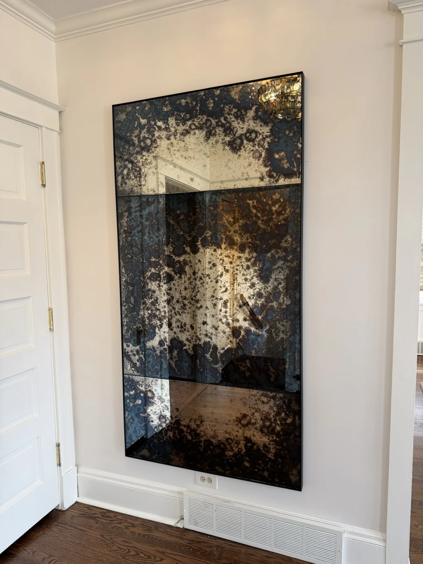 Completed mirror installation by ORLEG Mounting Services