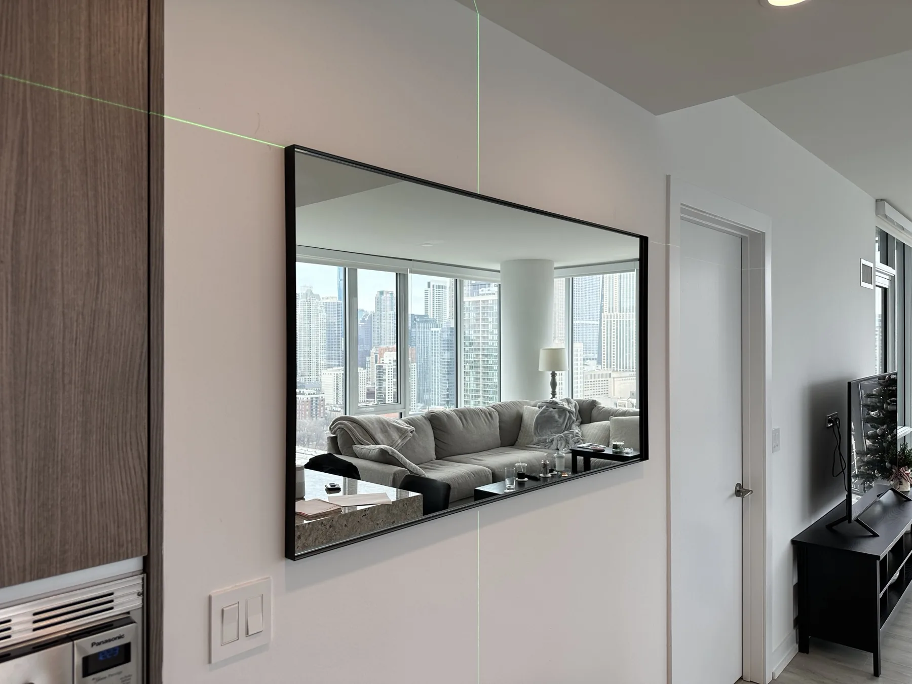 Completed mirror installation by ORLEG Mounting Services
